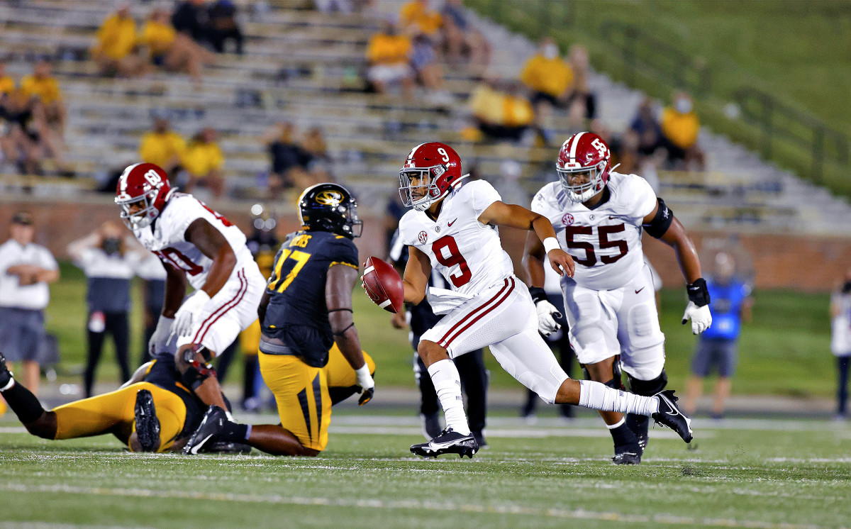 Alabama's Bryce Young runs with the ball